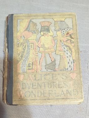 antique edition of book Alice's Adventures in Wonderland by Lewis Carroll 1897
